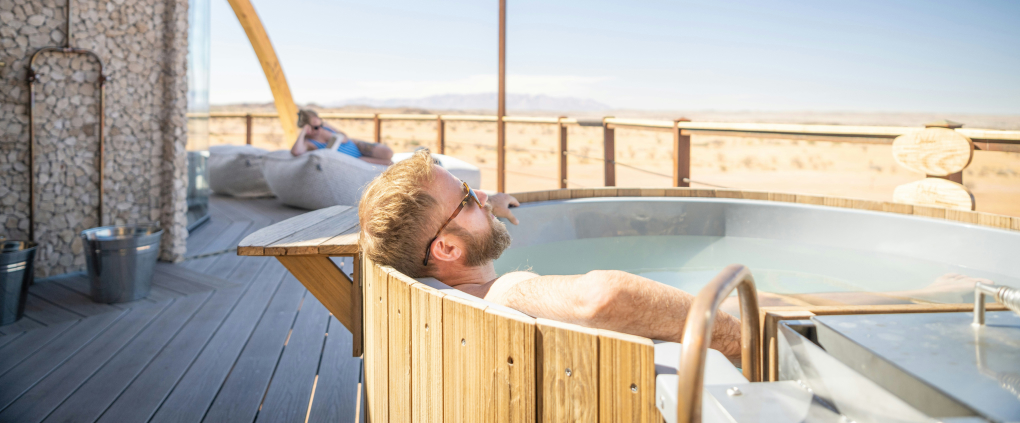 man in hot tub on holiday