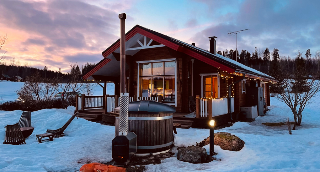 snowy lodge with hot tub